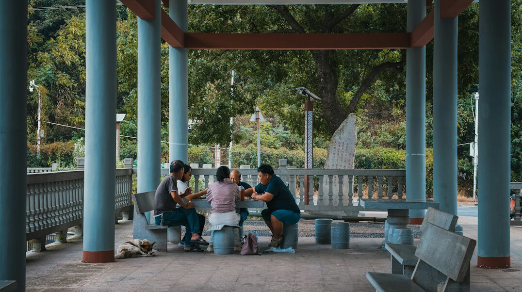 Group of people in a circle discussing in a community meeting