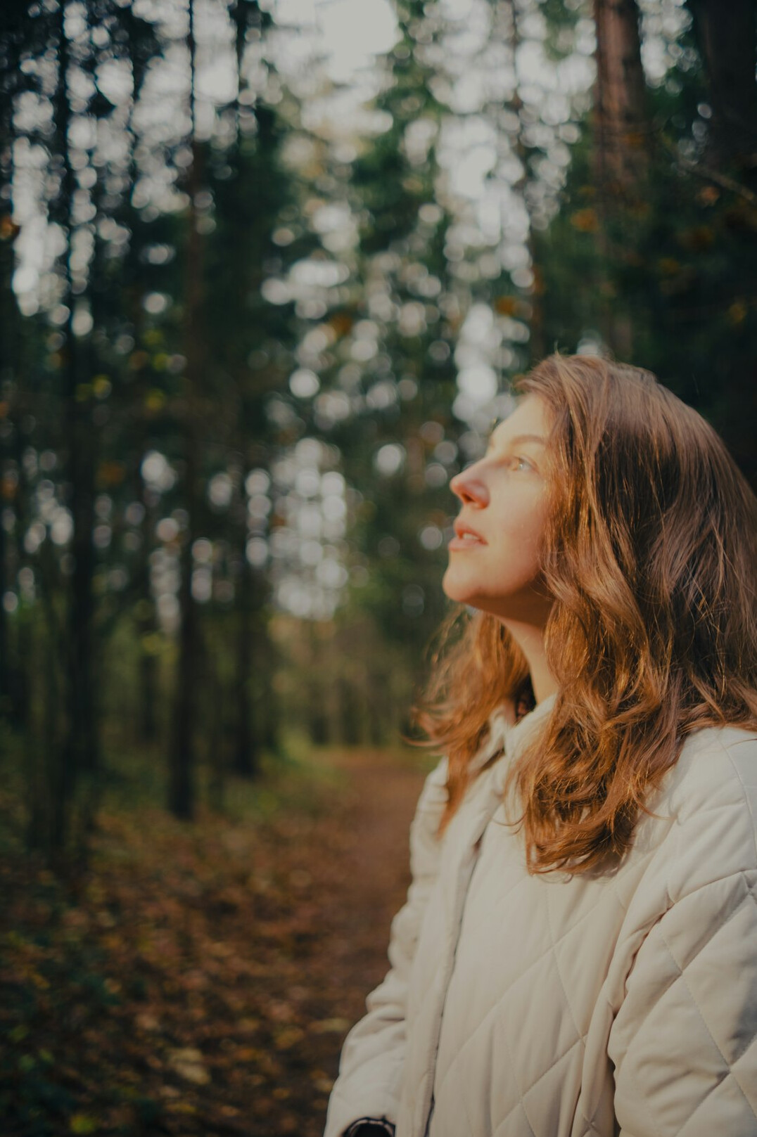 woman meditating in forest