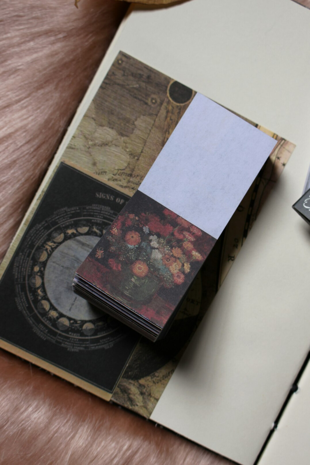 Person writing reflections in a journal at a wooden desk