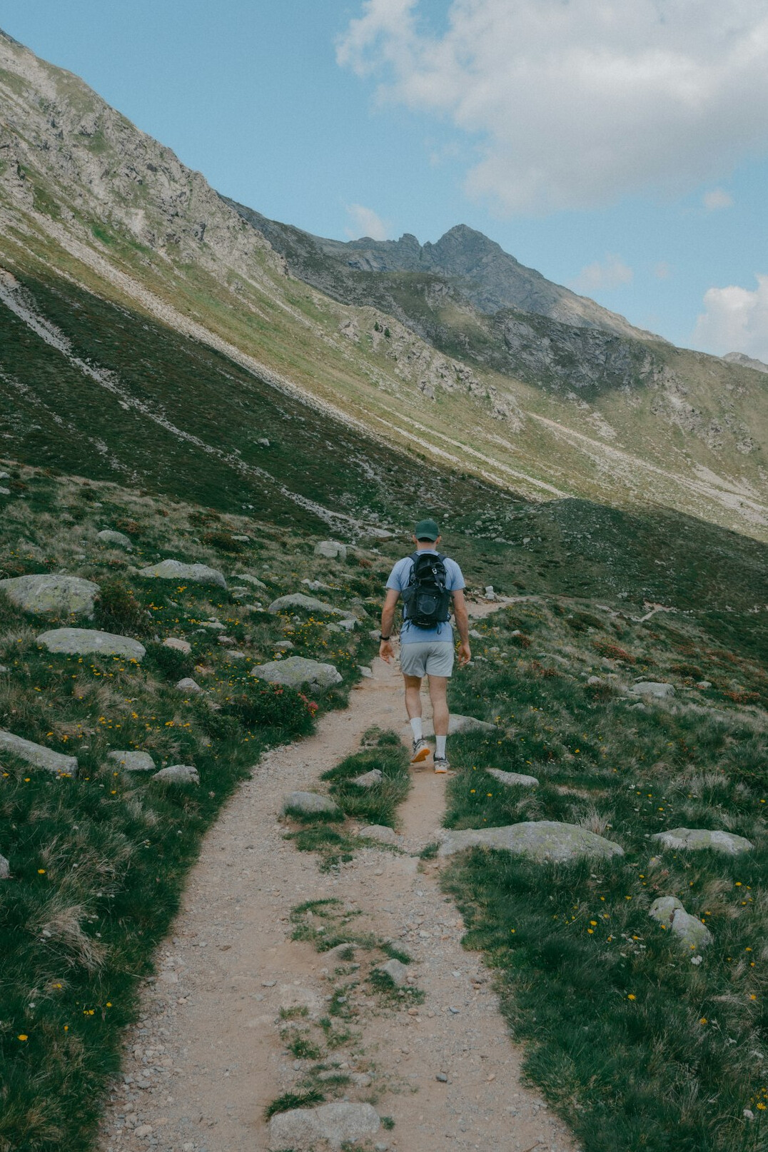 person climbing mountain path