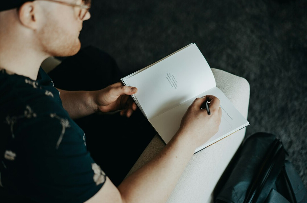 person journaling about communication